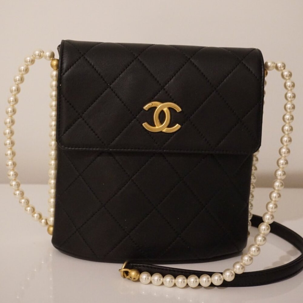 Chanel pearl cross by bag